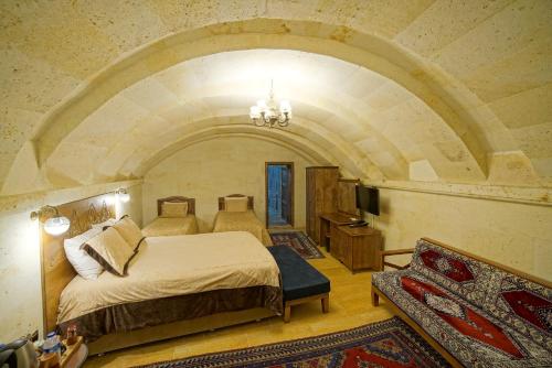 Postel nebo postele na pokoji v ubytování Lucky Cave Hotel Cappadocia