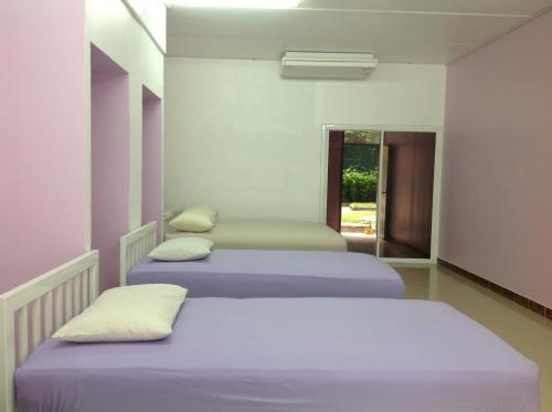 מיטה או מיטות בחדר ב-Baan Khun Rak