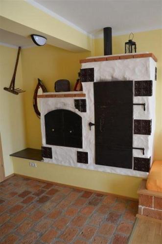 a kitchen with a fake stove in the corner of a room at Kerndlerhof in Ybbs an der Donau