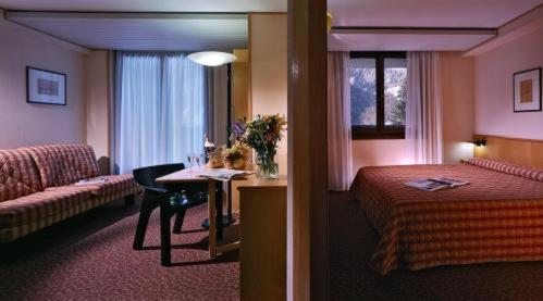 Krevet ili kreveti u jedinici u objektu Hotel Les Jumeaux Courmayeur