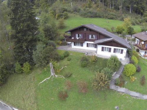 an aerial view of a house on a hill at Apartment Goldrose by Interhome in Zweisimmen