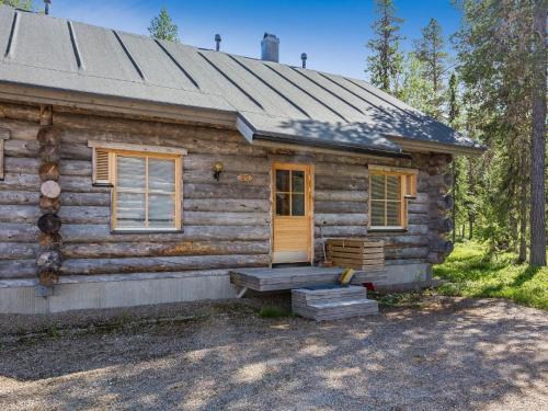 a log cabin with a porch and a door at Holiday Home Teerentie - poronpesä - g20 by Interhome in Äkäslompolo