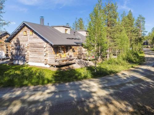 a log cabin with a road in front of it at Holiday Home Kukasrakka a 4 by Interhome in Äkäslompolo