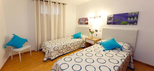 Postel nebo postele na pokoji v ubytování Typic Sandic Apartments
