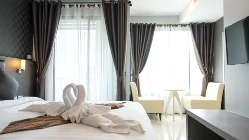 Krevet ili kreveti u jedinici u objektu Picnic Hotel Bangkok - Rang Nam