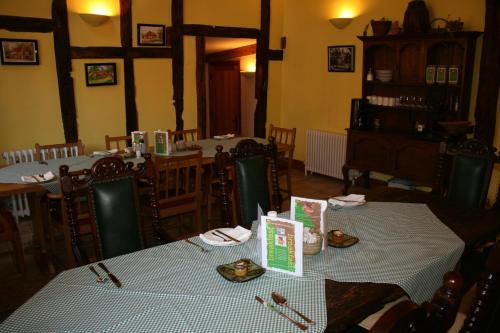 a dining room with two tables in a restaurant at Upper Neatham Mill in Alton