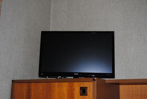 TV at/o entertainment center sa Appartement Chantemerle