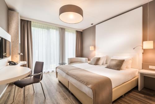 Postel nebo postele na pokoji v ubytování Fletcher Hotel-Restaurant de Wageningsche Berg
