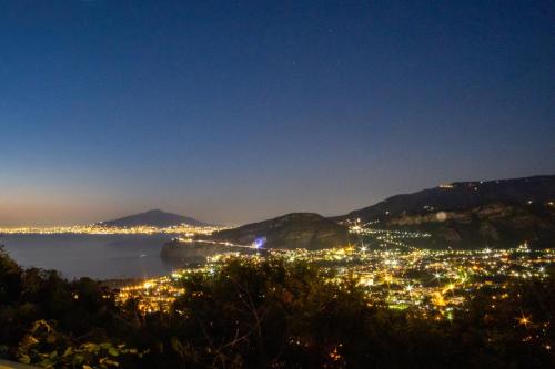 a view of the city of positano at night at Villa Monica B&B in Sorrento