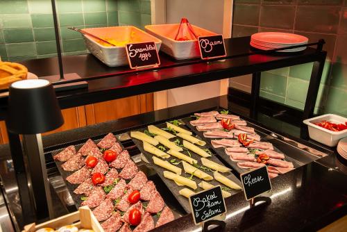 a display case with many different types of food at Albergo Etico Roma in Rome