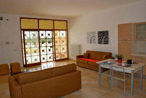 a living room with a couch and a table at B&B Santa Lucia in Manfredonia