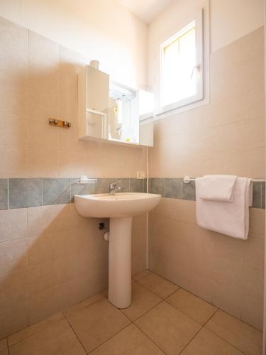 a bathroom with a sink and a mirror at Gasparina Village in Castelnuovo del Garda