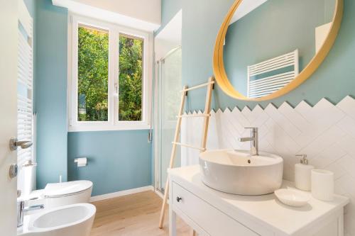 a bathroom with a sink and a mirror at Casa Babette by PortofinoHomes in Rapallo