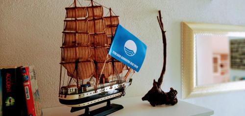 a small model of a ship sitting on a table at La Perla del Sud in Teulada