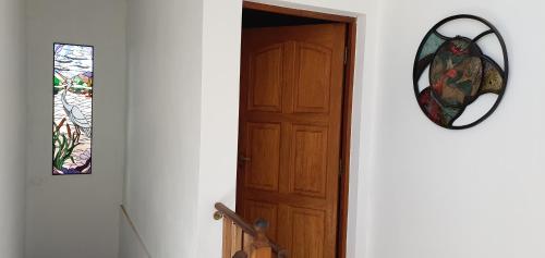 a door with a stained glass window next to it at Alojamiento Tía Silvia in San José
