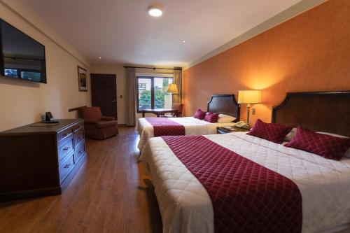 Ένα ή περισσότερα κρεβάτια σε δωμάτιο στο Gran Hotel Cochabamba