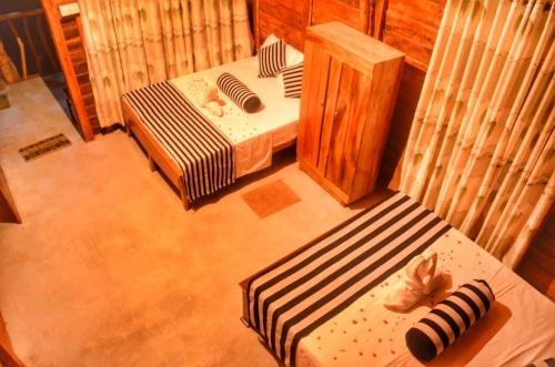 an overhead view of a room with a bed and a chair at Green Garden Resort in Habarana