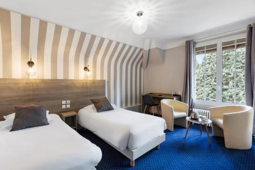 A bed or beds in a room at Sure Hotel by Best Western Port Jérome - Le Havre
