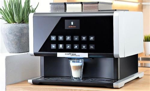 a coffee maker with a glass of coffee in it at Ferienhaus Feuerstein in Elend