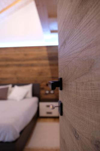Ένα ή περισσότερα κρεβάτια σε δωμάτιο στο Alpine Home Fiemme