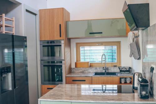 Kuchyň nebo kuchyňský kout v ubytování Stylish apartments at Penati Golf Resort