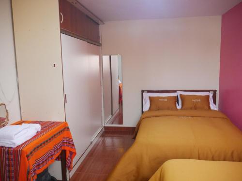 Krevet ili kreveti u jedinici u objektu RUNAWASI Peruvian Home
