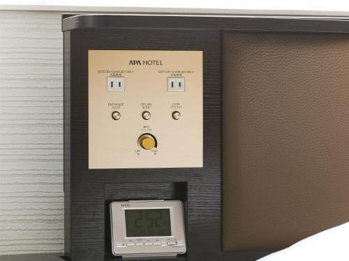 an am hotel machine with a monitor on it at APA Hotel Yamagata Tsuruoka Ekimae in Tsuruoka