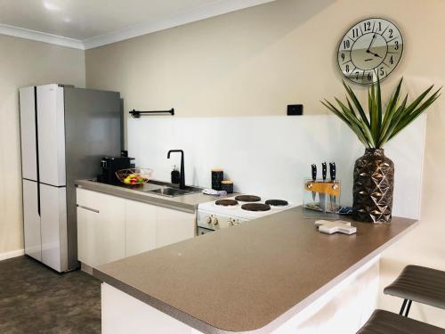 
A kitchen or kitchenette at West Beach Lagoon 220 Stylish and Cozy
