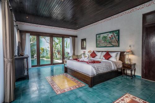 เตียงในห้องที่ Villa Tanah Carik by Mahaputra