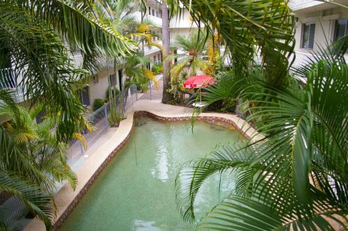 an overhead view of a swimming pool in a building at Koala Beach Resort Cairns in Cairns