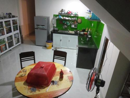 a kitchen with a table with a cake on it at Ngũ Hành Sơn in Da Nang