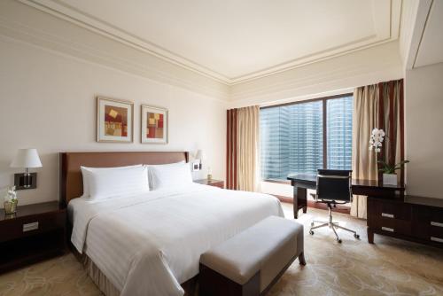 Un ou plusieurs lits dans un hébergement de l'établissement Edsa Shangri-La, Manila