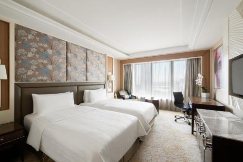 Un ou plusieurs lits dans un hébergement de l'établissement Edsa Shangri-La, Manila
