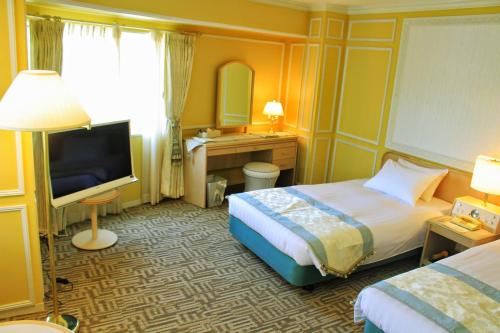 Postel nebo postele na pokoji v ubytování Hotel Heritage