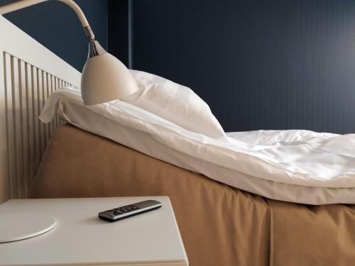 Ένα ή περισσότερα κρεβάτια σε δωμάτιο στο Hotel Stensson