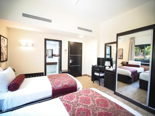 Postel nebo postele na pokoji v ubytování New Capitol Hotel - Jerusalem