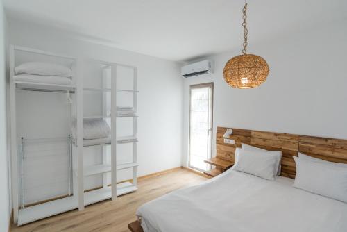 A bed or beds in a room at Camping Gradina