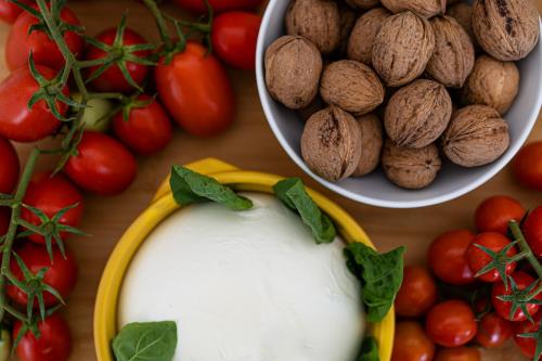 a table topped with tomatoes and a bowl of nuts at Do' Petro Relax & Pool in Vico Equense