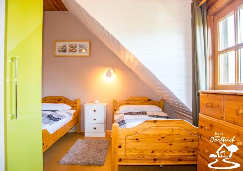 Postel nebo postele na pokoji v ubytování Haus am Dorfteich Fehmarn