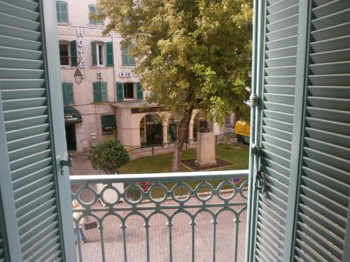 a view of a street from a window at Little Palace in Toulon