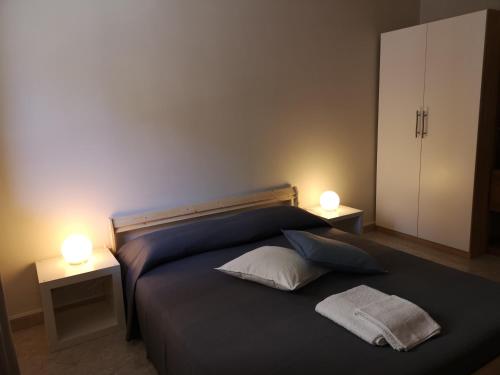 Postel nebo postele na pokoji v ubytování "Dint e viche e Napule" Guest House