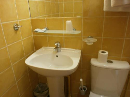 a bathroom with a sink and a toilet at Little Palace in Toulon