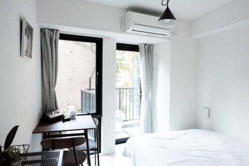 NEST HATAGAYA Stylish Apt房間的床