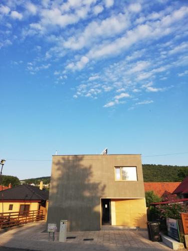 a building with a sky in the background at VIGEO lounge b&b coffee in Bojnice