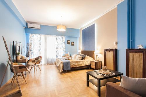 a bedroom with a bed and a living room at Cozy, Central, Safe Double rooms in apartment, close to Acropolis in Athens
