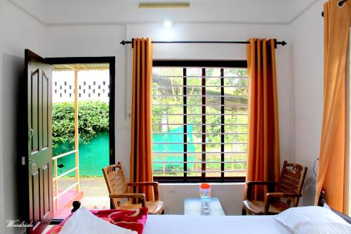 Postel nebo postele na pokoji v ubytování Woodside Homestay Wayanad