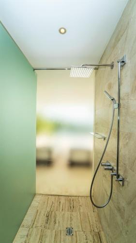 a bathroom with a shower in a room at Cap el Limon Luxury Villas in El Limón