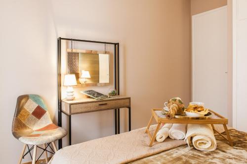 a bedroom with a mirror and a table and a chair at Cozy, Central, Safe Double rooms in apartment, close to Acropolis in Athens
