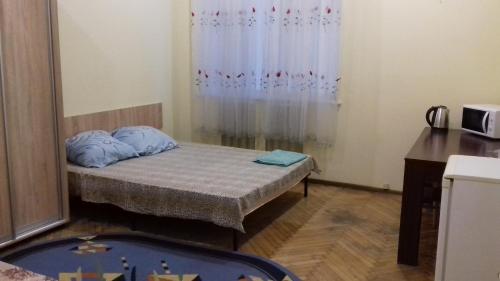 A bed or beds in a room at вулиця Пушкінська67/69