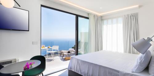 A television and/or entertainment centre at The View Luxury Apartments Taormina